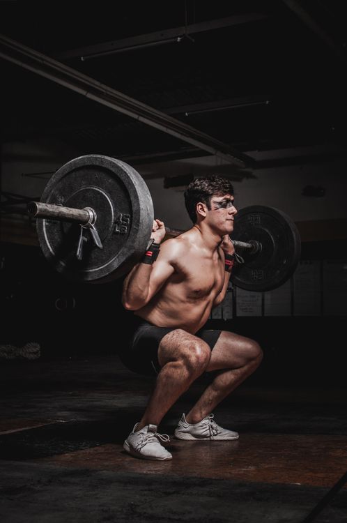Beginner client doing first workout with trainer