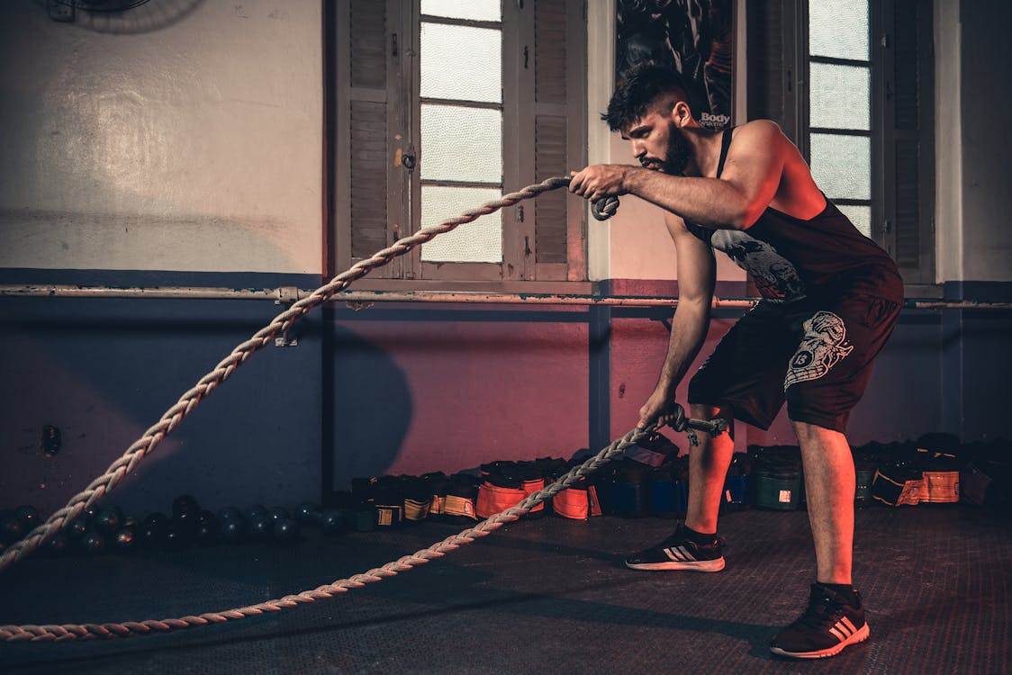 Personal trainer guiding client through exercise